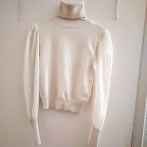 . No listing of mine has ever been worn. Tulle sleeve funnel neck shirt